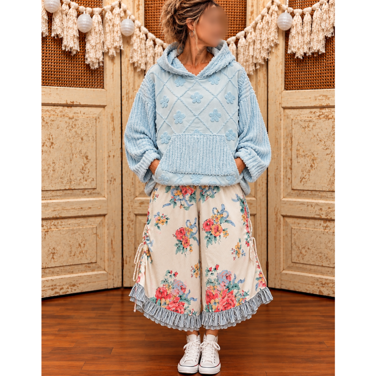 Powder-blue textured floral hoodie styled with cream floral wide-leg pants